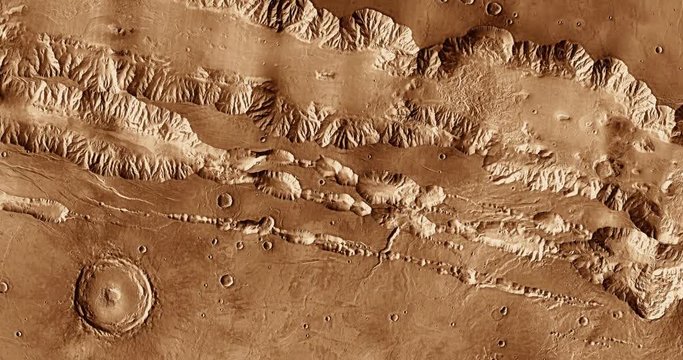 Very high altitude aerial flyover of Mars' Coprates Chasma. No HUD. Clip is reversible and can be rotated 180 degrees. Data: NASA/JPL/USGS