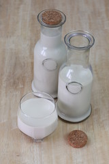 Milk in glass bottles, closeup,vintage, background