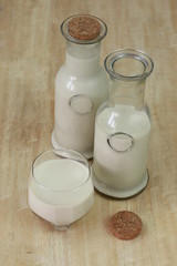 Obraz na płótnie Canvas Milk in glass bottles, closeup,vintage, background