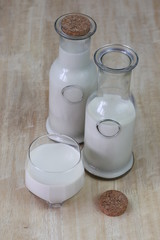 Milk in glass bottles, closeup,vintage, background