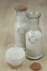 Milk in glass bottles, closeup, background