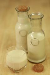 Milk in glass bottles, closeup,vintage, background