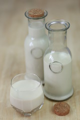 Milk in glass bottles, closeup, background