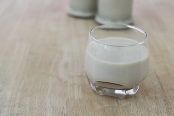 Milk in glass bottles, closeup, background