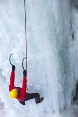 The climber climbs on ice.