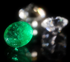 green gem on a black background.