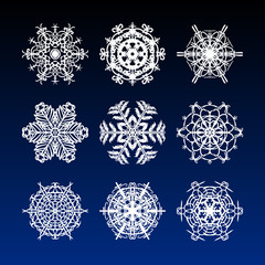 Christmas snowflakes set with complicated beautiful and filigree hand drawn snow stars for holiday ornaments, corporate greeting prints and greeting cards
