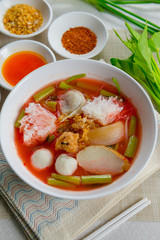 pink seafood flat noodle (Tom Yum Yen-Ta-Fo)