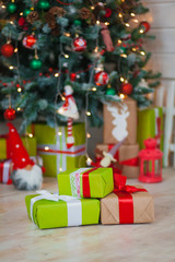 Christmas gifts on the background of trees