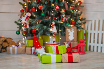 Christmas gifts on the background of trees