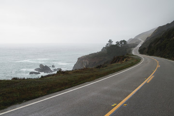 Road winding along the coast of california