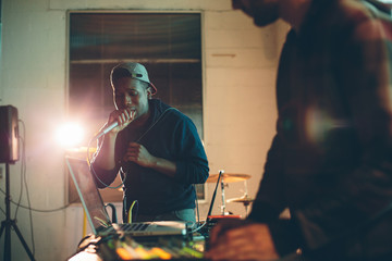 rapper and DJ perform a live set