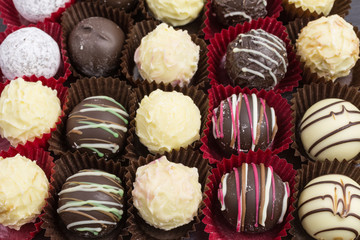 differently decorated white and brown chocolate truffles