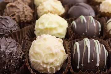 differently decorated white and brown chocolate truffles