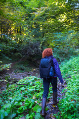 Hiker woman on a trail by the river