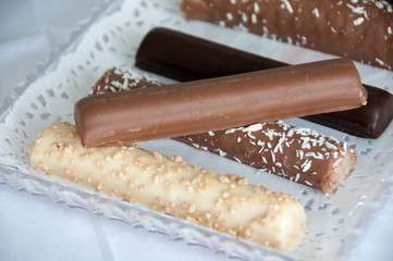 chaocolate candy sticky bars with coconut flakes