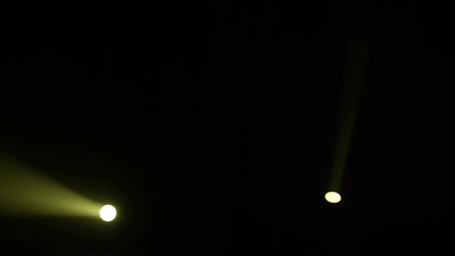 Realistic footage of stage light flashing rays spotlights through smoke. Great as a natural stage background for different projects!!!