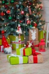 Fototapeta na wymiar Christmas gifts on the background of trees
