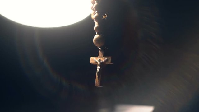 The wooden rosary in the light