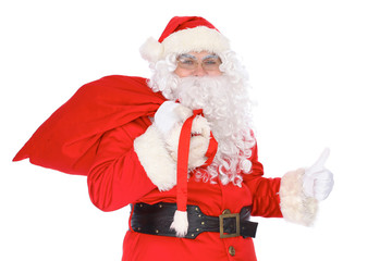 Santa Claus carrying big bag and showing thumbs up or ok isolated on white background. Full length portrait