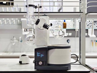 Laboratory rotary evaporator with chemical preparation in flask