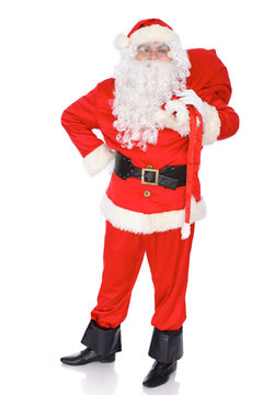 Santa Claus carrying big bag. Isolated on white background. Full length portrait