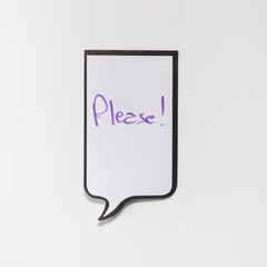 a white memo pad with the shape of a comic with the inscription "please"