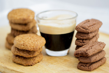 espresso coffee and dried cookies