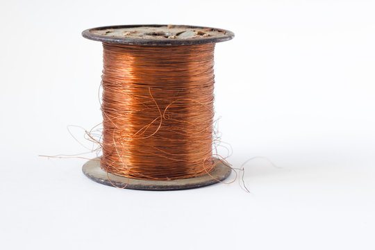 Copper wire on spool, isolated on white backgrounds, with clipping paths on white background .