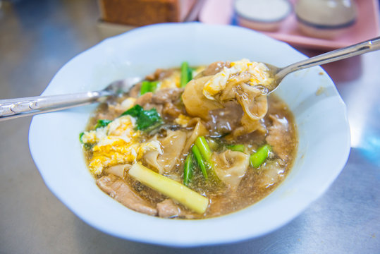 noodle with pork and egg in gravy