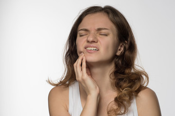 Fototapeta premium Young beautiful giirl on white background with toothache
