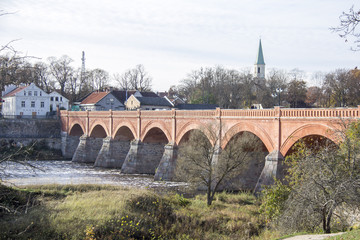 old Brick bridge across the River Venta in the city of Kuldiga Latvia 
