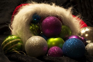 Magical colorful Christmas decorations compacted in a red stocking with white furry trimming