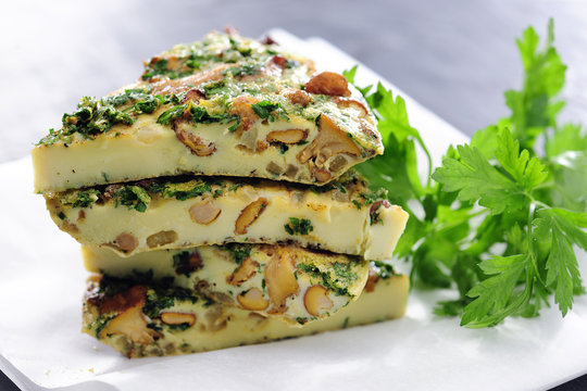 Food: Pieces of Chantarelle Frittata and Parsley