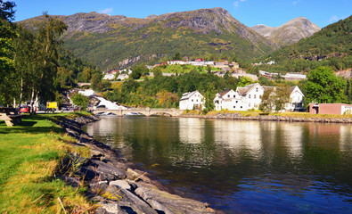 Waterfall in Hellesylt, a small town at the entrance to Geirangerfjord on a sunny summer day