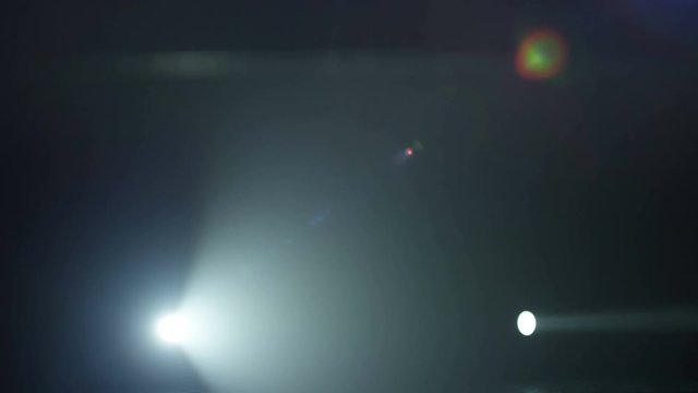 Realistic footage of stage light flashing rays spotlights through smoke. Great as a natural stage background for different projects!!!