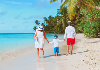 happy family with kids walk on beach