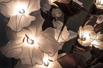 burning night light made of nylon flowers