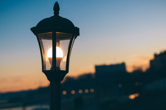 Glowing Street Lamp In The City