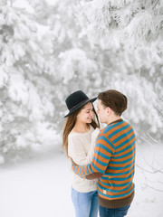 Couple man and woman looking at each other. Winter portrait
