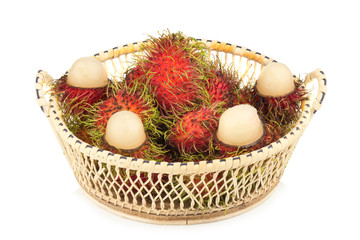 rambutan in basket isolated on white background