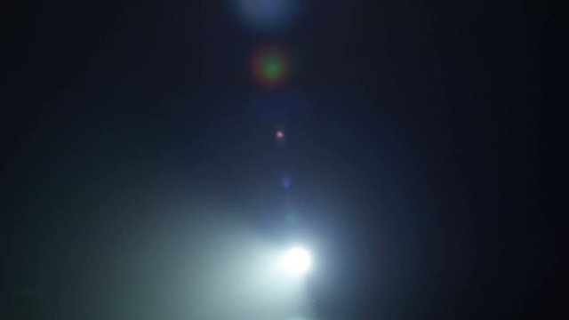 Realistic footage of stage light flashing rays spotlights through smoke. Great as a natural stage background for different projects!!!