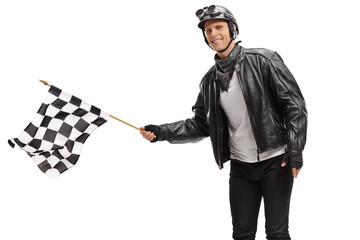 Biker waving a checkered race flag © Ljupco Smokovski