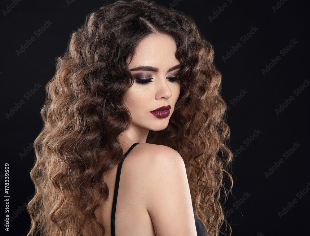 Wall mural beauty girl hair. curly hairstyle. brunette girl with healthy long hair, beauty makeup. beautiful wo