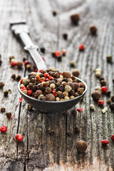 pepper on wooden background/ mixture of peppers hot pepper, red pepper, black pepper, white pepper, green pepper, background