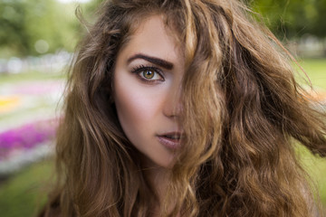 Naklejka premium Female beauty closeup. Modern youth portrait. Pretty girl hair, tender look