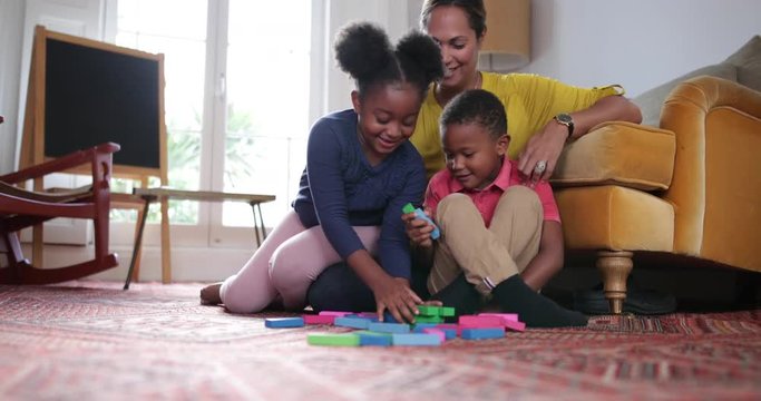 Mum with Kids building a tower
