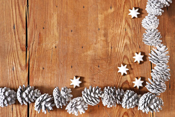 seasonal  background with pinecones and cinnamon stars