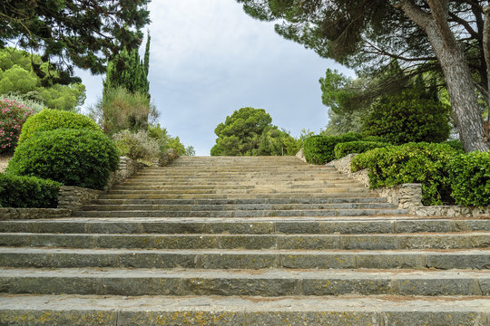 stairs of the Greek and Roman ruins of the archaeological place of Ampurias, on the brave coast in Spain.