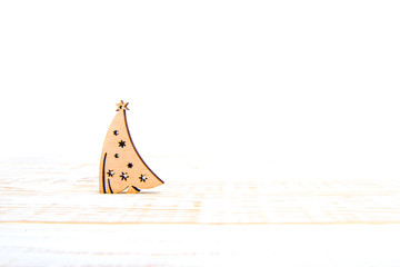 Wooden christmas tree on white background. Winter time. Empty space for text.